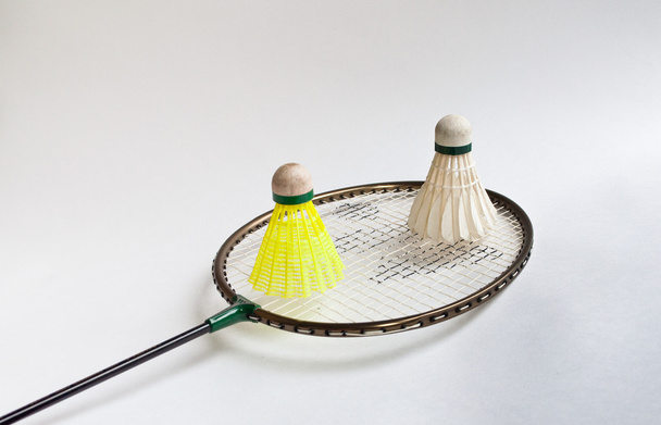 Badminton racket, shuttlecock on a white background. - Fotó, kép