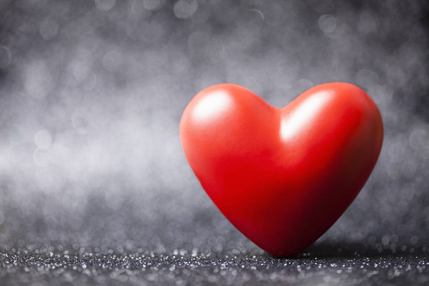 Red heart on black shiny background - Photo, image