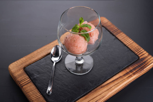 Ice cream dessert in a glass on a dark background. - Photo, Image