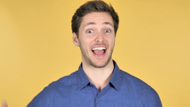 Thumbs Up by Casual Young Man on Yellow Background - Filmmaterial, Video