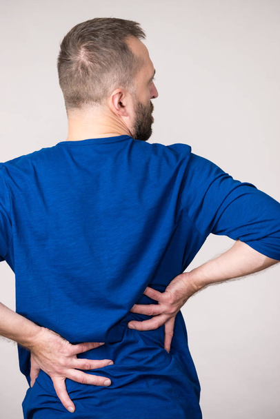Man having back loins pain ache - Fotoğraf, Görsel