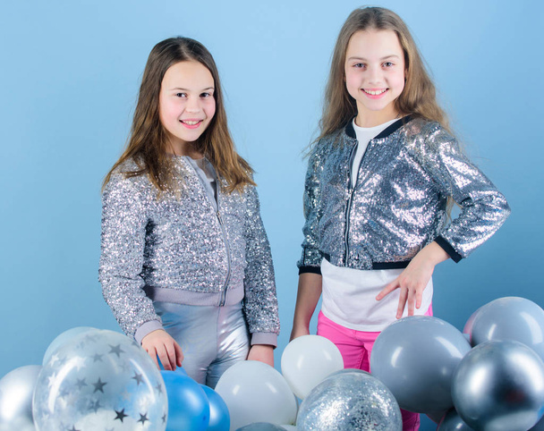 Carefree childhood. Start this party. Sisters organize home party. Having fun concept. Balloon theme party. Girls little siblings near air balloons. Birthday party. Happiness and cheerful moments - Photo, Image