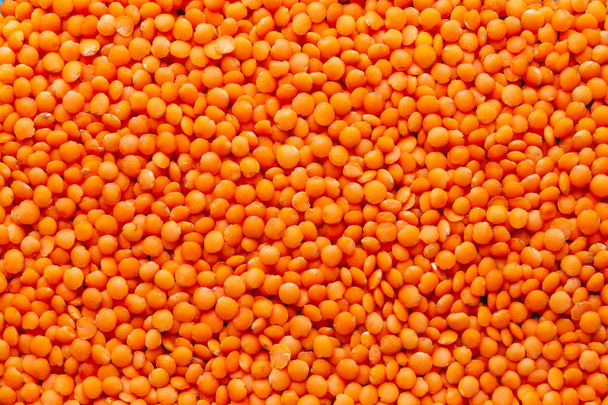 Red lentils. Background with lots of lentils.  - Fotografie, Obrázek