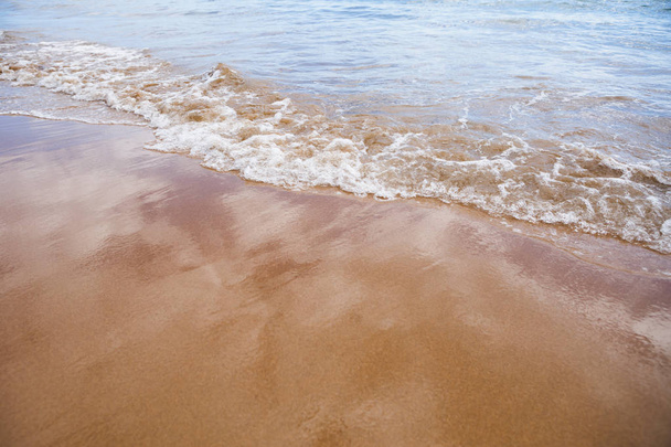 wet sand beach background and sea water - Foto, Imagem