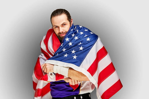 american Football Player with uniform and american flag proud of his country, on a white background. - 写真・画像