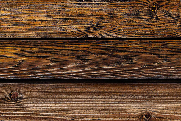 nastavení hnědých desek vodorovné čáry ošlehané staré dřevěné základový podklad venkovský design - Fotografie, Obrázek
