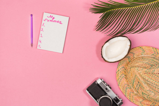 summer plan, camera, hat,  on a pink background top view - Zdjęcie, obraz