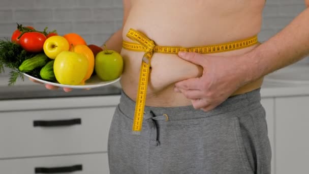 hombre gordo que mide su cintura, alimentación sana, concepto sano del estilo de vida, dieta de la aptitud
 - Metraje, vídeo