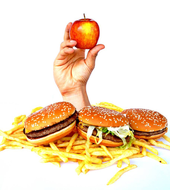 La mano de un montón de comida rápida
 - Foto, imagen