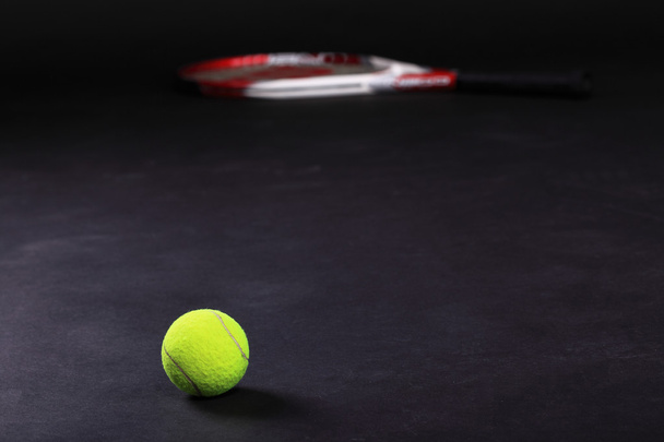 tennis racket and balls on black background - Fotó, kép