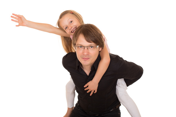 Man giving piggyback ride to a little girl - Photo, Image
