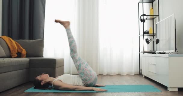 Young woman doing yoga at home. Healthy and sport lifestyle. - Filmmaterial, Video