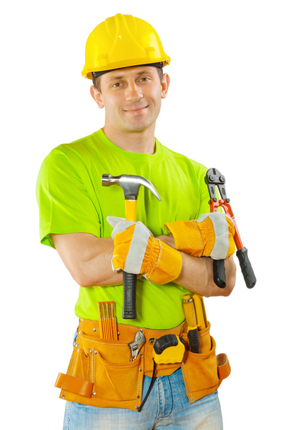 A worker holding hammer and steel cutter - Fotoğraf, Görsel
