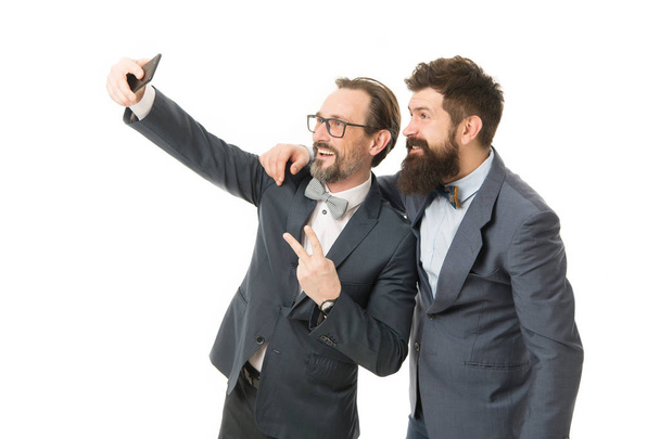 Taking photo with business idol. Selfie of successful friends. Entrepreneurs taking selfie together. Business people concept. Men bearded guys formal suits. Business conference famous speaker - Фото, зображення