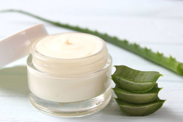 cream with aloe vera on a light background. Aloe vera skin care. Moisturizing and skin care. - Photo, Image