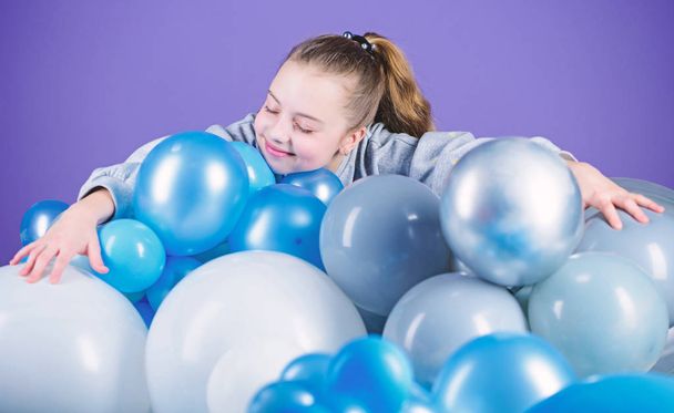 Girl between air balloons. Birthday party. Childrens day. Carefree childhood. All those balloons for me. Happiness positive emotions. Obsessed with air balloons. Having fun. Balloons theme party - Φωτογραφία, εικόνα