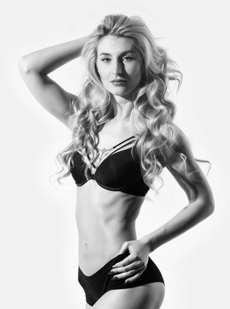 Perfect body in sexy lingerie. Fashion model with fit belly. Erotic lingerie and underwear. Hair beauty of sensual girl. Perfect body shape. Sexy blond woman. Sexy woman with long curly hair - Valokuva, kuva