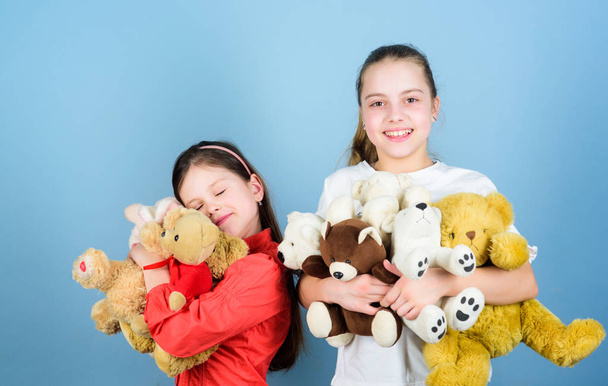 Childhood concept. Softness and tenderness. Laundry softener. Love and friendship. Kids adorable cute girls play soft toys. Happy childhood. Child care. Sisters best friends play. Sweet childhood - Fotoğraf, Görsel