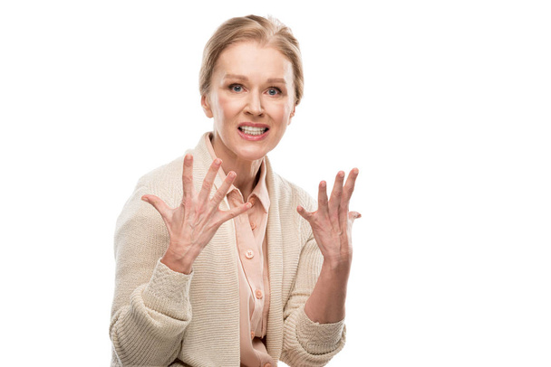 stressed middle aged woman looking at camera and Gesturing Isolated On White - 写真・画像