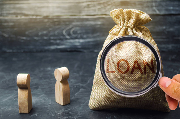 The concept of Loan. Businessmen are discussing questions about the company's loans. The financial loans between the lender and the borrower. Secured and mortgage loan. Refinement interest rates - Photo, Image