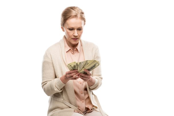 middle aged woman counting dollar banknotes Isolated On White with copy space - Valokuva, kuva