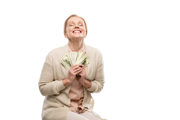 happy middle aged woman with dollar banknotes Isolated On White with copy space - Zdjęcie, obraz