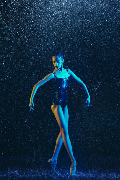 Two young female ballet dancers under water drops - 写真・画像