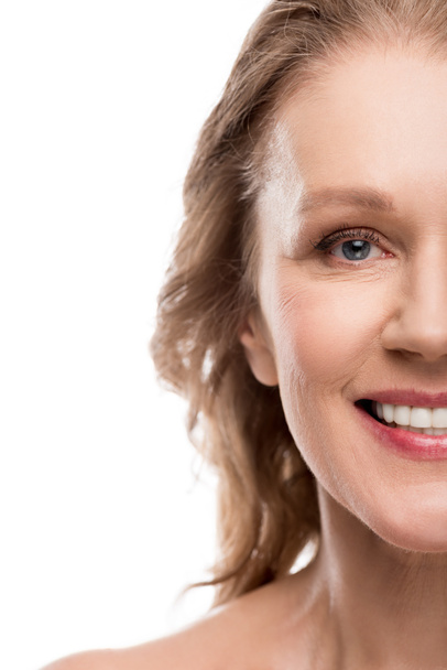 Cropped view of beautiful smiling middle aged woman with clean face Isolated On White  - Photo, Image