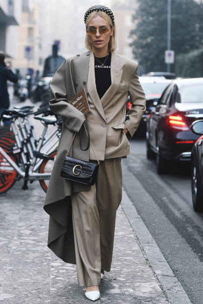 Milan, Italy - February 21, 2019: Street style Woman wearing Balenciaga after a fashion show during Milan Fashion Week - MFWFW19 - 写真・画像