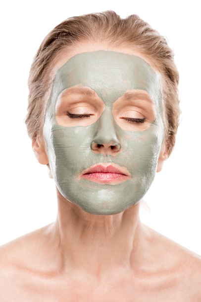 mature woman with clay mask and eyes closed Isolated On White - Φωτογραφία, εικόνα