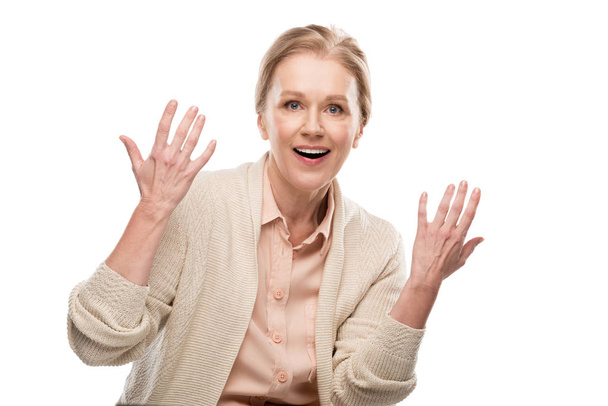 animado mulher de meia-idade Gesturing com as mãos Isolado no branco
 - Foto, Imagem