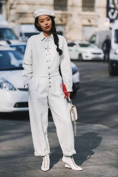 Milan, Italy - February 21, 2019: Street style Woman wearing a jumpsuit before a fashion show during Milan Fashion Week - MFWFW19 - Zdjęcie, obraz