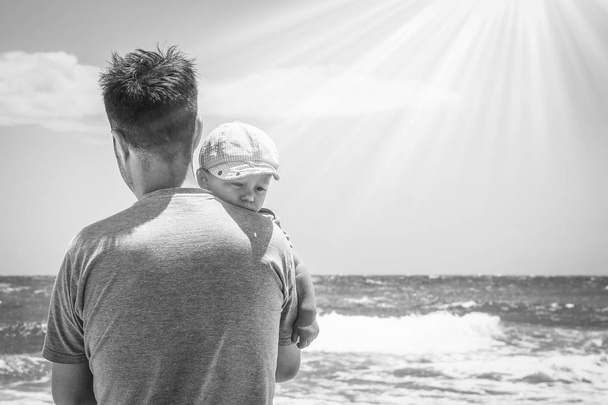 happy parent with a child by the sea in the open air - Foto, Bild