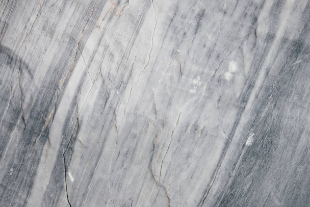 Marble in natural form. Texture of marble rock close up. Background image of beautiful stone. - Photo, Image