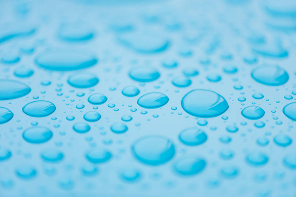 Drops of water on a blue, azure surface. Seamless texture. Pattern. Backdrop  - Photo, Image
