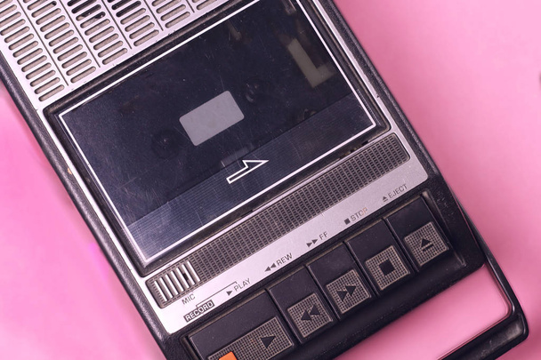 Old retro vintage 70s, 80s, 90s style portable  audio  tape cassette  recorder radio  on a pink background top view - Photo, Image