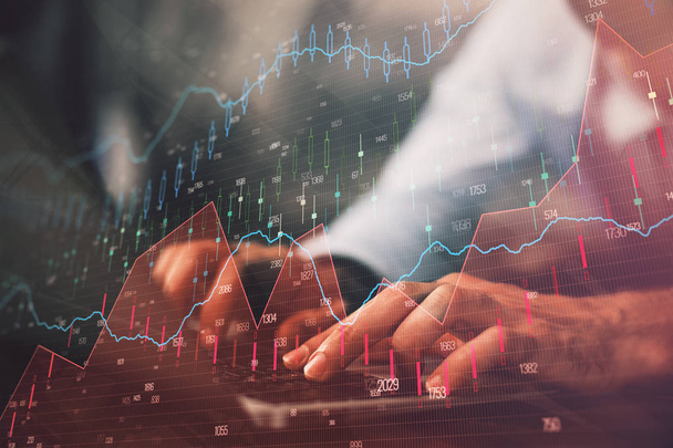 Hands typing on laptop. Business and Financial concept. Double exposure of stock market charts. - Fotoğraf, Görsel
