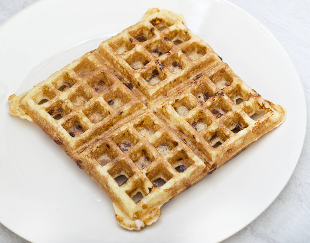 Homemade square belgian waffle on white plate - Photo, Image