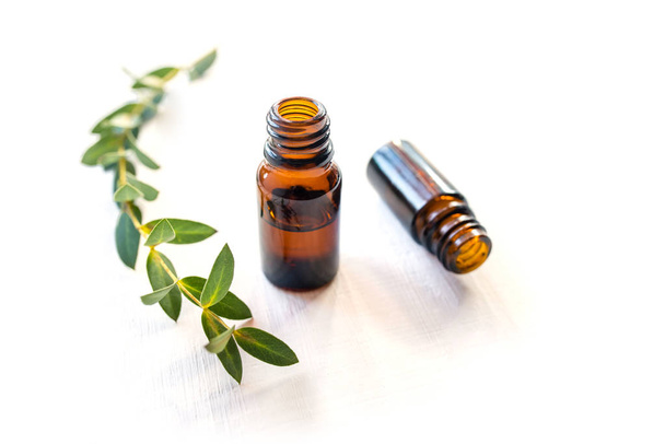 Dark glass bottles with essential oil. - Photo, image