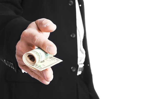 Business man holding money on white background - Valokuva, kuva