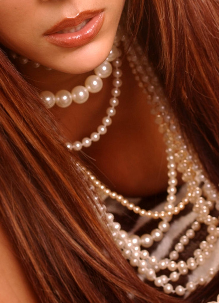 Stunning long hair brunette red lips with string of pearls - Photo, image