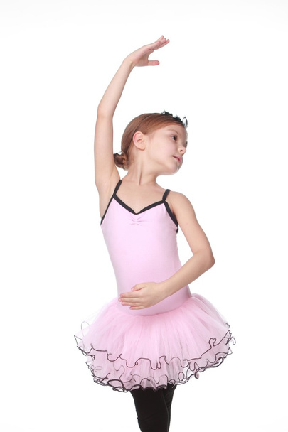 Young ballerina wearing lovely tutu dancing like a swangirl isolated over white background - Foto, Bild