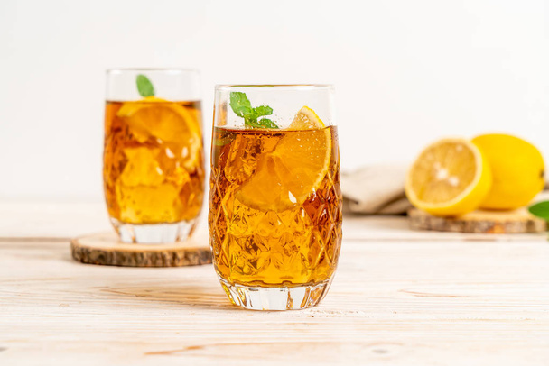 glass of ice lemon tea - Фото, изображение