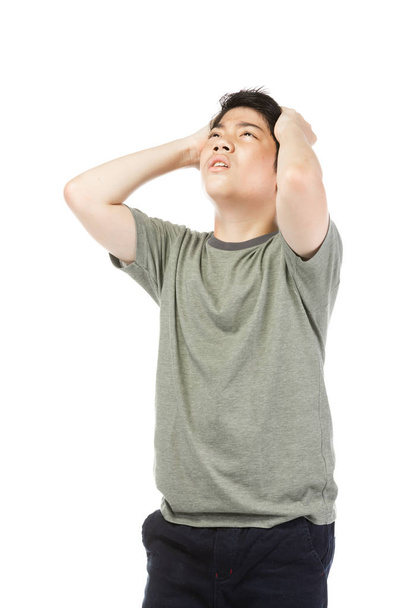 Young Asian boy over white background, be upset; have a bad temp - Фото, зображення