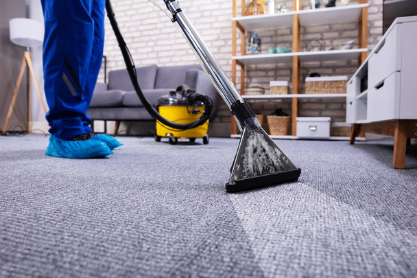 Human Cleaning Carpet In The Living Room Using Vacuum Cleaner At Home - Photo, Image