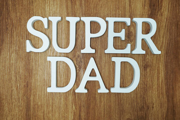 Super Dad Word alphabet letters on wooden background - Foto, afbeelding