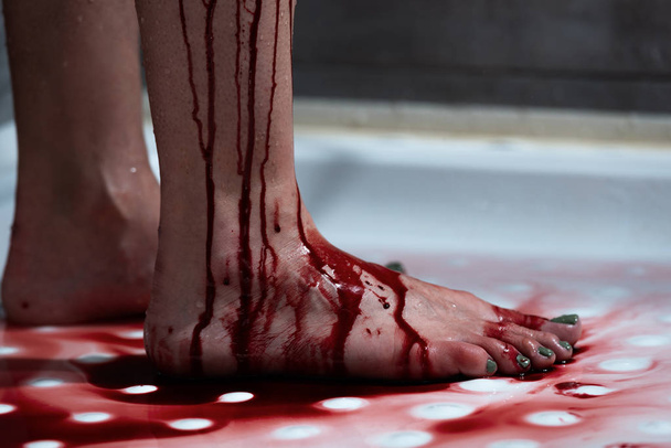 cropped view of barefoot bleeding woman in bathroom - Photo, Image