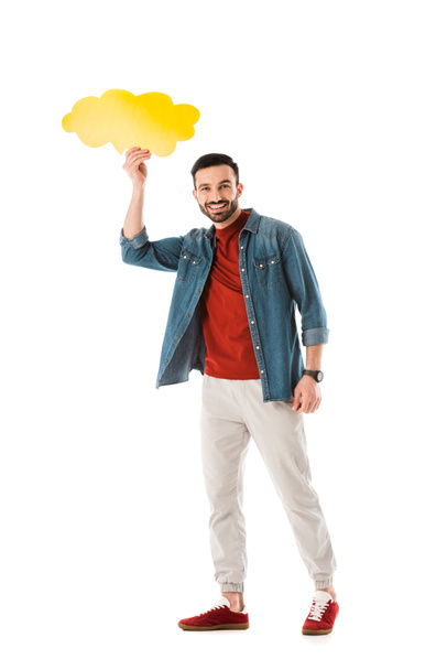 cheerful bearded man holding thought bubble over head and looking at camera isolated on white - Photo, Image