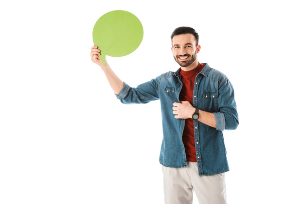 cheerful man in denim shirt holding thought bubble and looking at camera isolated on white - Foto, Imagem