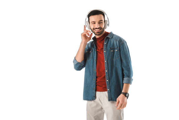 cheerful man in denim shirt listening music in headphones isolated on white - Valokuva, kuva